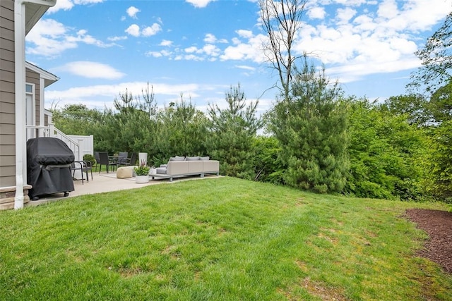 view of grassy yard with a patio area and outdoor lounge area