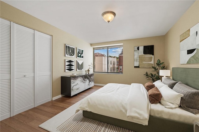 5708 Walnut Unit B2, Shadyside, PA 15232 - bedroom with wood finished floors, a closet, and baseboards