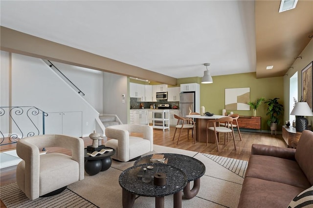 5708 Walnut Unit B2, Shadyside, PA 15232 - living room with light wood-type flooring and stairs