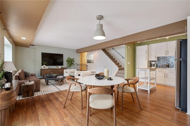 5708 Walnut Unit B2, Shadyside, PA 15232 - dining space with stairway and light wood finished floors