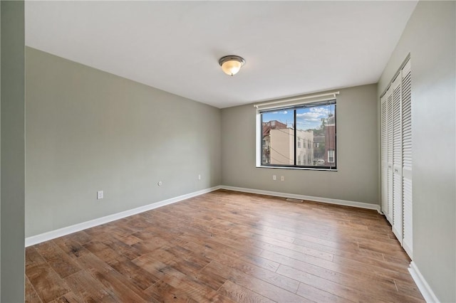 5708 Walnut Unit B2, Shadyside, PA 15232 - unfurnished bedroom featuring wood finished floors, baseboards, and a closet