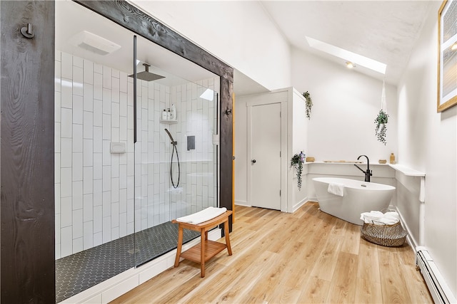 147 Crimson Oak Rd, Jefferson Twp Som, PA 15501 - bathroom featuring a baseboard radiator, a skylight, a freestanding bath, a walk in shower, and wood finished floors