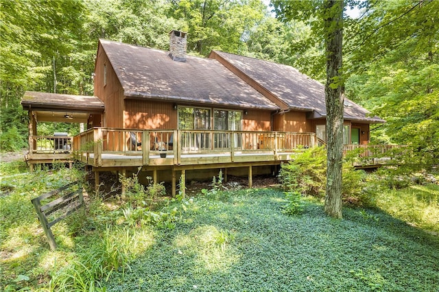 147 Crimson Oak Rd, Jefferson Twp Som, PA 15501 - rear view of house with a chimney, a deck, and roof with shingles