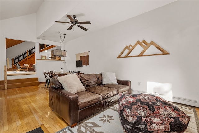 147 Crimson Oak Rd, Jefferson Twp Som, PA 15501 - living area with wood-type flooring, ceiling fan, lofted ceiling, and stairway
