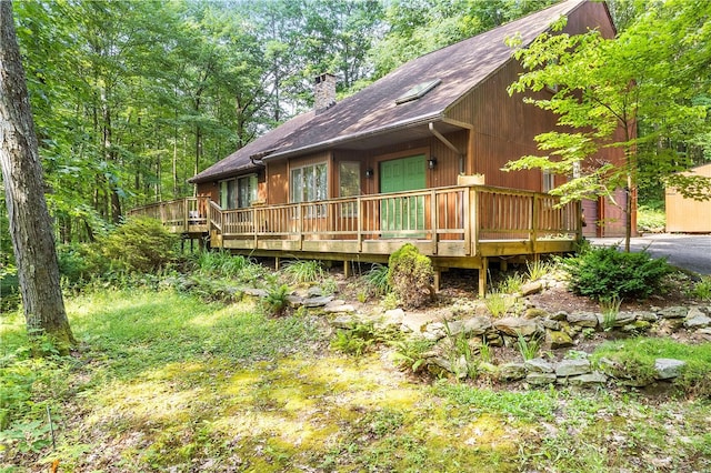147 Crimson Oak Rd, Jefferson Twp Som, PA 15501 - rustic home with a chimney, a wooden deck, and a shingled roof