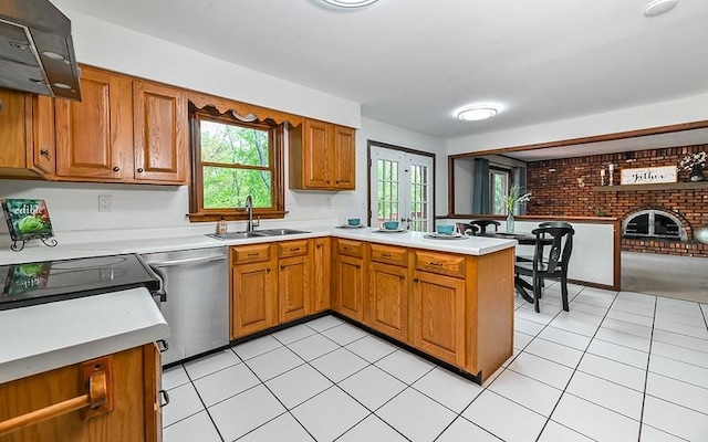 kitchen with a sink, range hood, dishwasher, brown cabinetry, and plenty of natural light