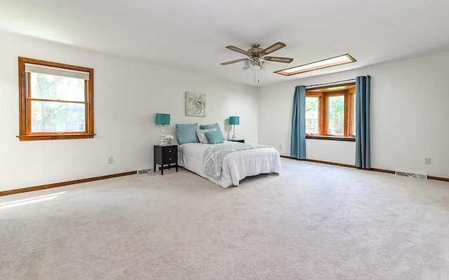 bedroom featuring carpet flooring, baseboards, and a ceiling fan