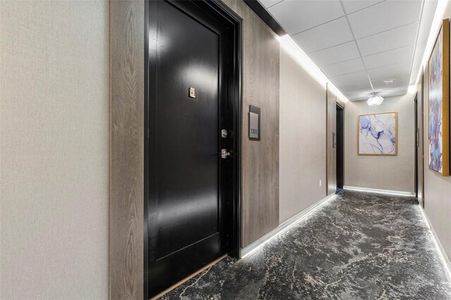 350 Oliver Ave Unit 1203, Downtown Pgh, PA 15222 - hall featuring baseboards, unfinished concrete floors, and a drop ceiling