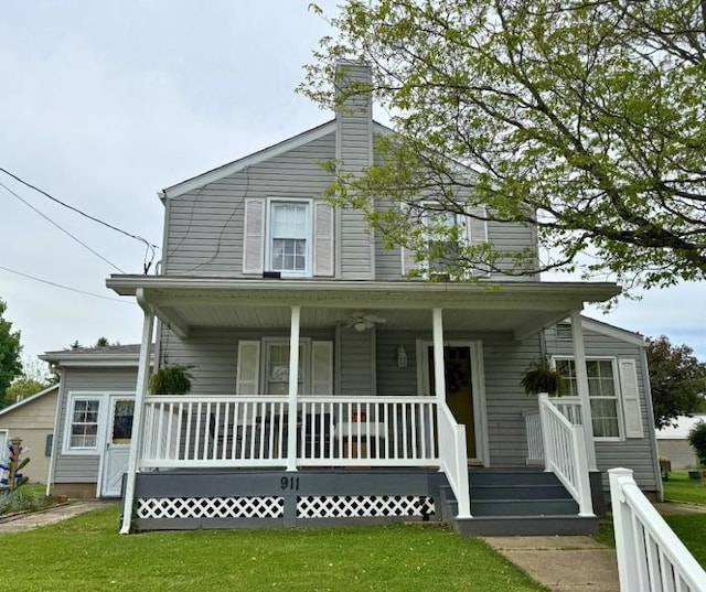 911 Columbia Ave, Grove City Boro, PA 16127 - view of front of home with covered porch, a chimney, and a front yard