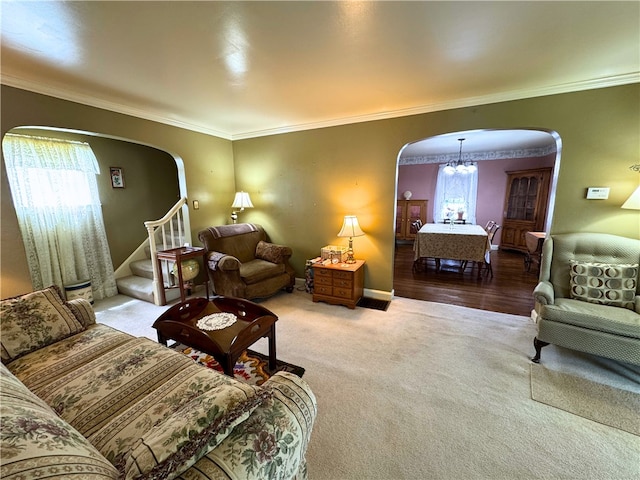 911 Columbia Ave, Grove City Boro, PA 16127 - carpeted living area with arched walkways, a chandelier, crown molding, stairway, and baseboards