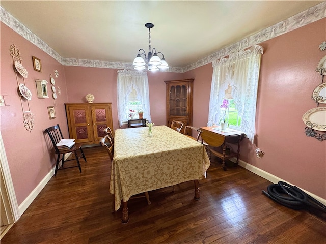 911 Columbia Ave, Grove City Boro, PA 16127 - dining space with a chandelier, dark wood finished floors, and baseboards