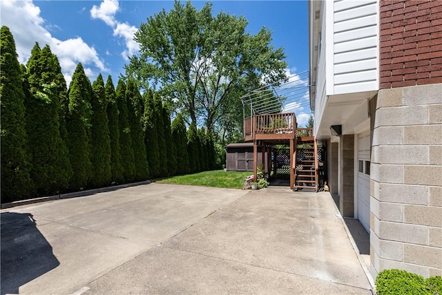 view of patio / terrace with stairs and a wooden deck