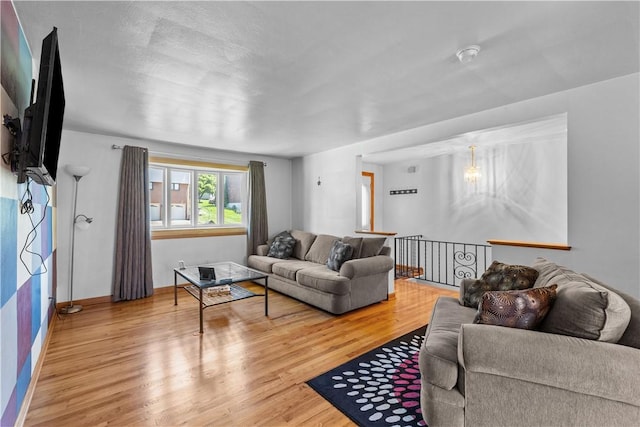living room with wood finished floors and baseboards