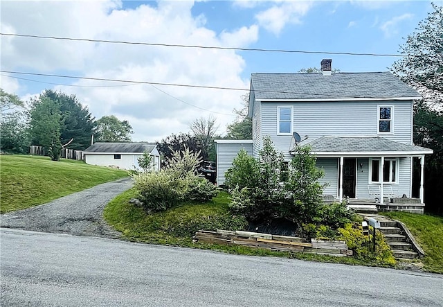 128 Cessna Hill Rd, Jenner Twp, PA 15531 - view of front facade featuring a porch, a front lawn, and a chimney