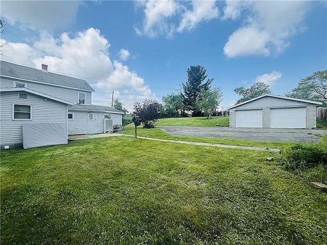128 Cessna Hill Rd, Jenner Twp, PA 15531 - view of green lawn with an outdoor structure and a detached garage