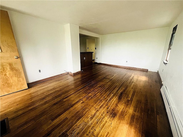 128 Cessna Hill Rd, Jenner Twp, PA 15531 - unfurnished room with a baseboard radiator, dark wood-type flooring, and baseboards