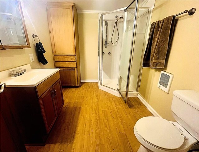 128 Cessna Hill Rd, Jenner Twp, PA 15531 - bathroom featuring wood finished floors, a stall shower, toilet, vanity, and heating unit