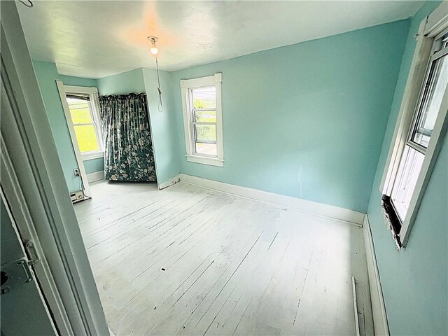 128 Cessna Hill Rd, Jenner Twp, PA 15531 - empty room with baseboards, healthy amount of natural light, and light wood finished floors