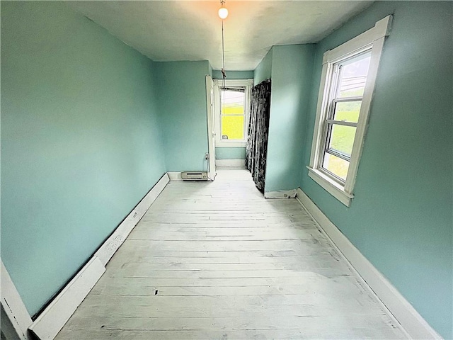 128 Cessna Hill Rd, Jenner Twp, PA 15531 - corridor with baseboards, healthy amount of natural light, and light wood-style flooring