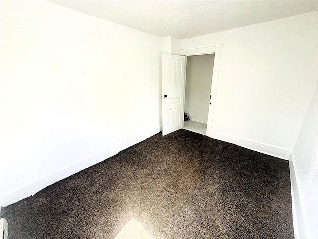 128 Cessna Hill Rd, Jenner Twp, PA 15531 - unfurnished room with baseboards and dark carpet