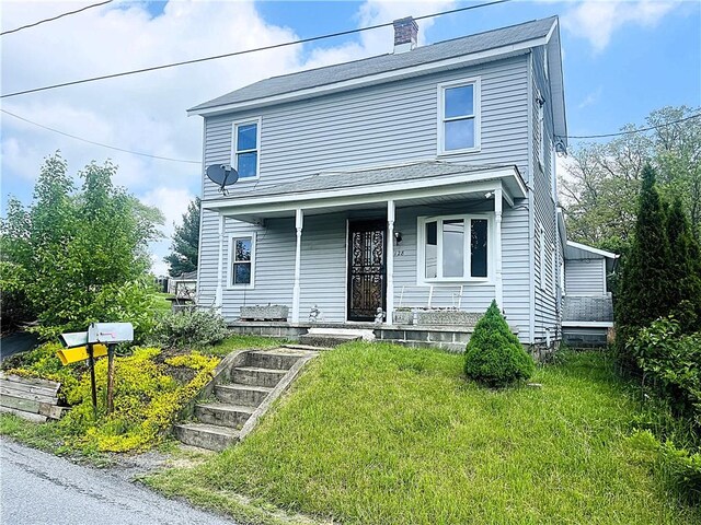 128 Cessna Hill Rd, Jenner Twp, PA 15531 - view of front of home with covered porch and a front lawn