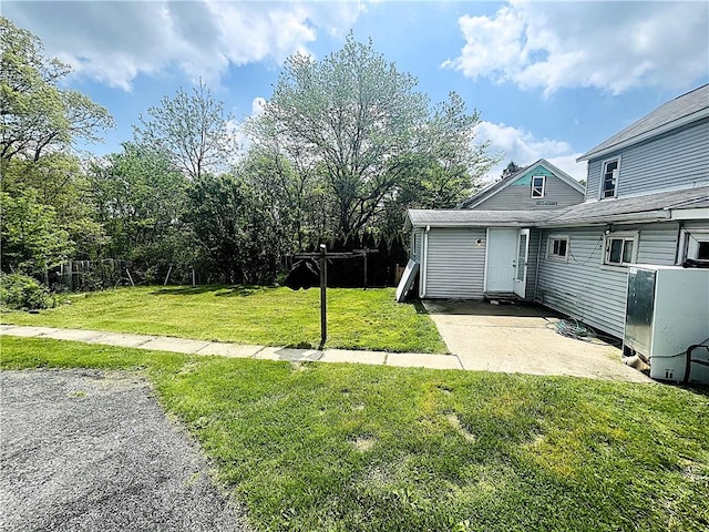 128 Cessna Hill Rd, Jenner Twp, PA 15531 - view of green lawn with a patio