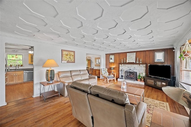 426 Oliver Dr, White Oak, PA 15131 - living room with light wood-style flooring and a fireplace