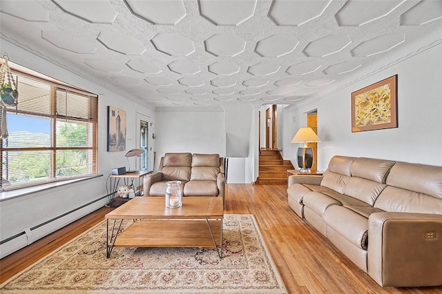 426 Oliver Dr, White Oak, PA 15131 - living area featuring a baseboard radiator, light wood finished floors, and stairs