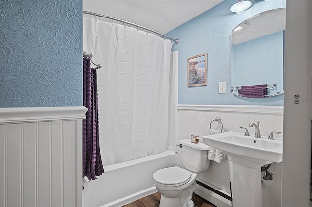 426 Oliver Dr, White Oak, PA 15131 - bathroom with baseboard heating, wood finished floors, wainscoting, a textured wall, and toilet