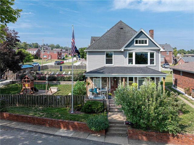 918 Arlington Prt, Vue, PA 15133 - view of front facade with a chimney, covered porch, a shingled roof, and a playground
