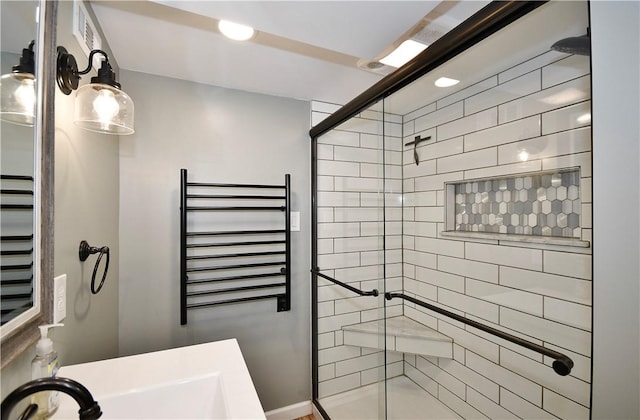 918 Arlington Prt, Vue, PA 15133 - bathroom featuring a shower stall, radiator, a towel warming rack, and a sink