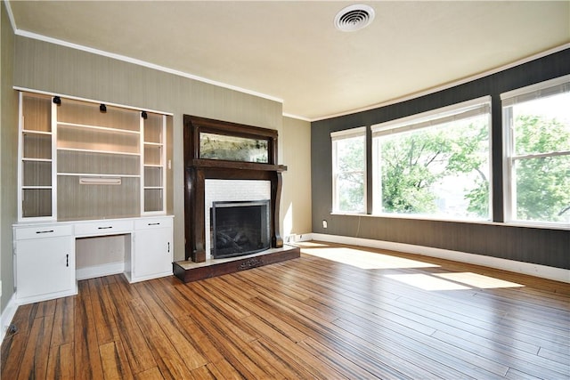 918 Arlington Prt, Vue, PA 15133 - unfurnished living room with ornamental molding, a fireplace with raised hearth, wood-type flooring, and baseboards