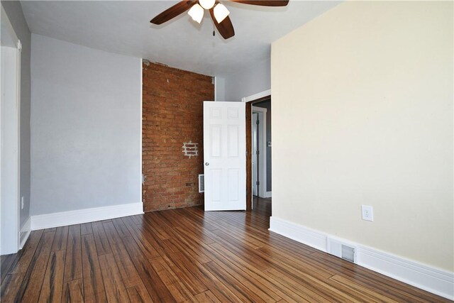 918 Arlington Prt, Vue, PA 15133 - spare room with ceiling fan, wood finished floors, baseboards, and brick wall