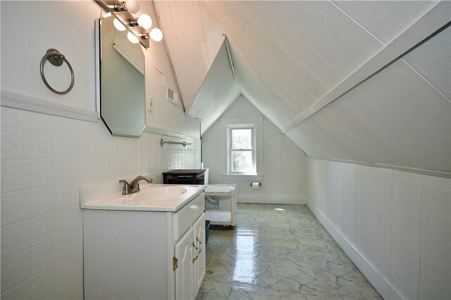 918 Arlington Prt, Vue, PA 15133 - bathroom featuring marble look tiles, vaulted ceiling, and vanity