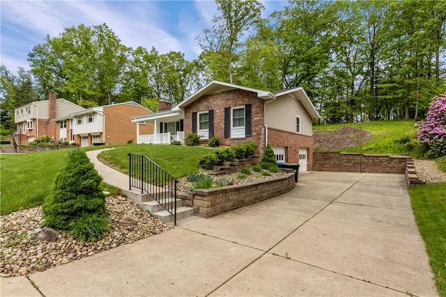 view of front facade with brick siding, concrete driveway, an attached garage, and a front yard