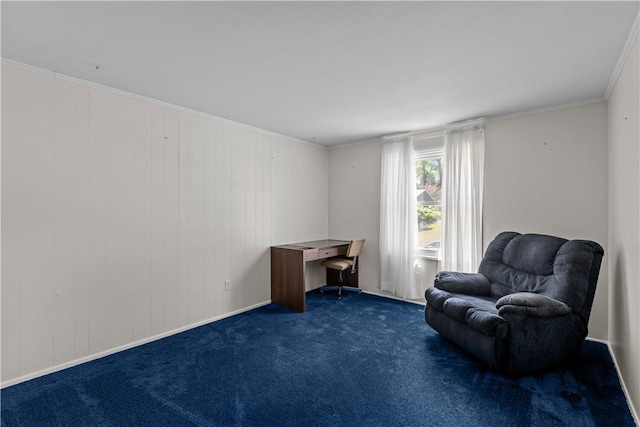 living area with carpet, a desk, ornamental molding, and baseboards