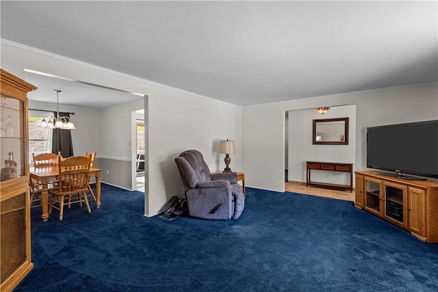 carpeted living area with a chandelier and ornamental molding