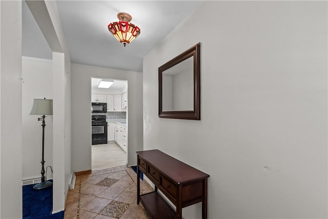 hall featuring light tile patterned floors