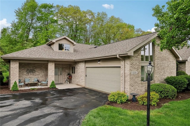 1231 Nicklaus Way W, Deer, PA 15044 - view of front of property with driveway, roof with shingles, brick siding, and a garage