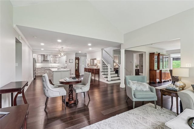 1231 Nicklaus Way W, Deer, PA 15044 - dining room with stairway, dark wood-style flooring, recessed lighting, vaulted ceiling, and a chandelier