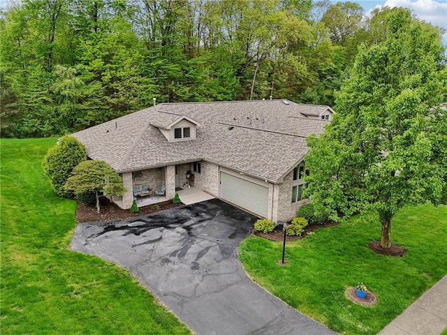 1231 Nicklaus Way W, Deer, PA 15044 - view of front of home featuring driveway, a front lawn, roof with shingles, a garage, and brick siding