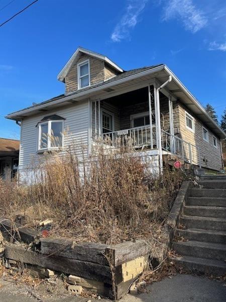 view of front of property with stairway
