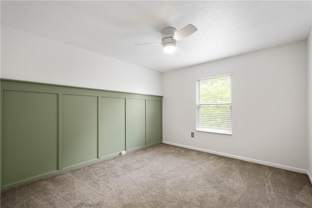 239 Mountain Dr, Carnegie, PA 15106 - unfurnished bedroom featuring carpet, ceiling fan, a decorative wall, and baseboards