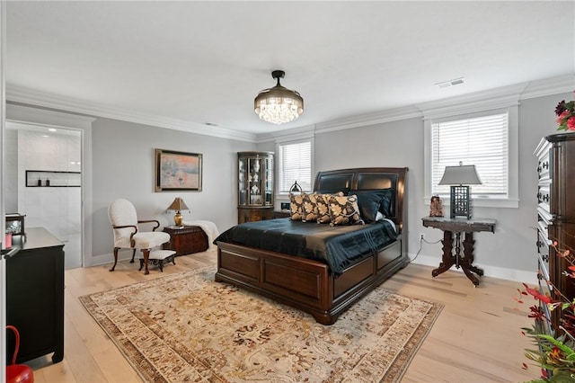 bedroom with light wood finished floors, crown molding, a chandelier, and baseboards