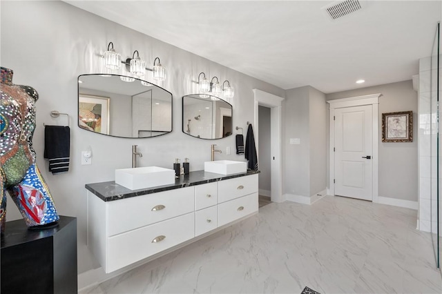 bathroom featuring double vanity, baseboards, recessed lighting, and marble finish floors