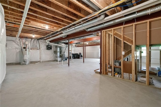 unfinished below grade area with gas water heater and heating unit