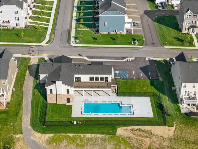 aerial view of residential area with a pool