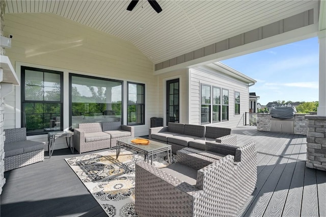 wooden terrace featuring outdoor lounge area, area for grilling, and ceiling fan