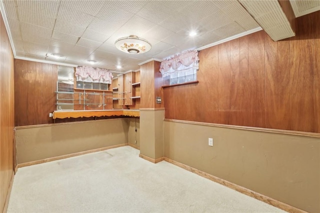 4782 Barone Dr, Whitehall, PA 15227 - bar area featuring carpet flooring, baseboards, ornamental molding, and wooden walls