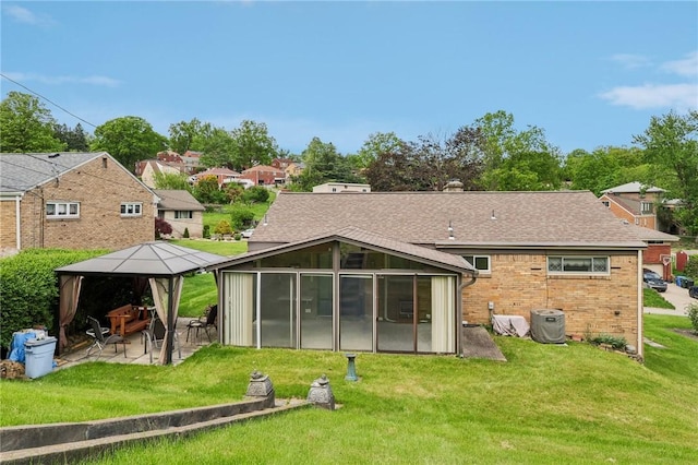 4782 Barone Dr, Whitehall, PA 15227 - back of property with a gazebo, a sunroom, a patio area, and a yard